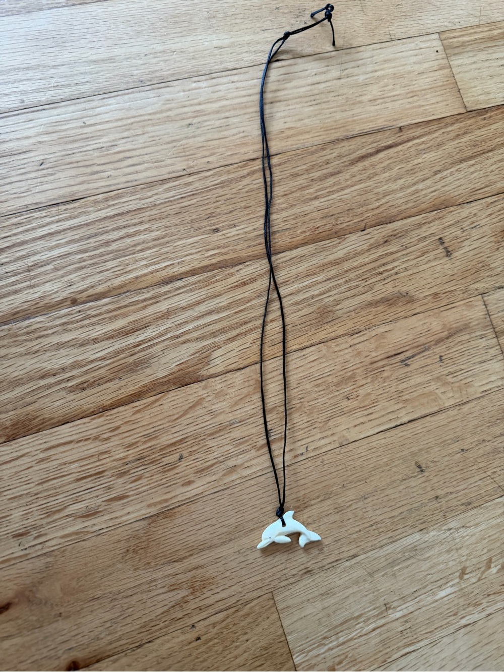 White Dolphin Pendant carved bone Necklace on Black Cord